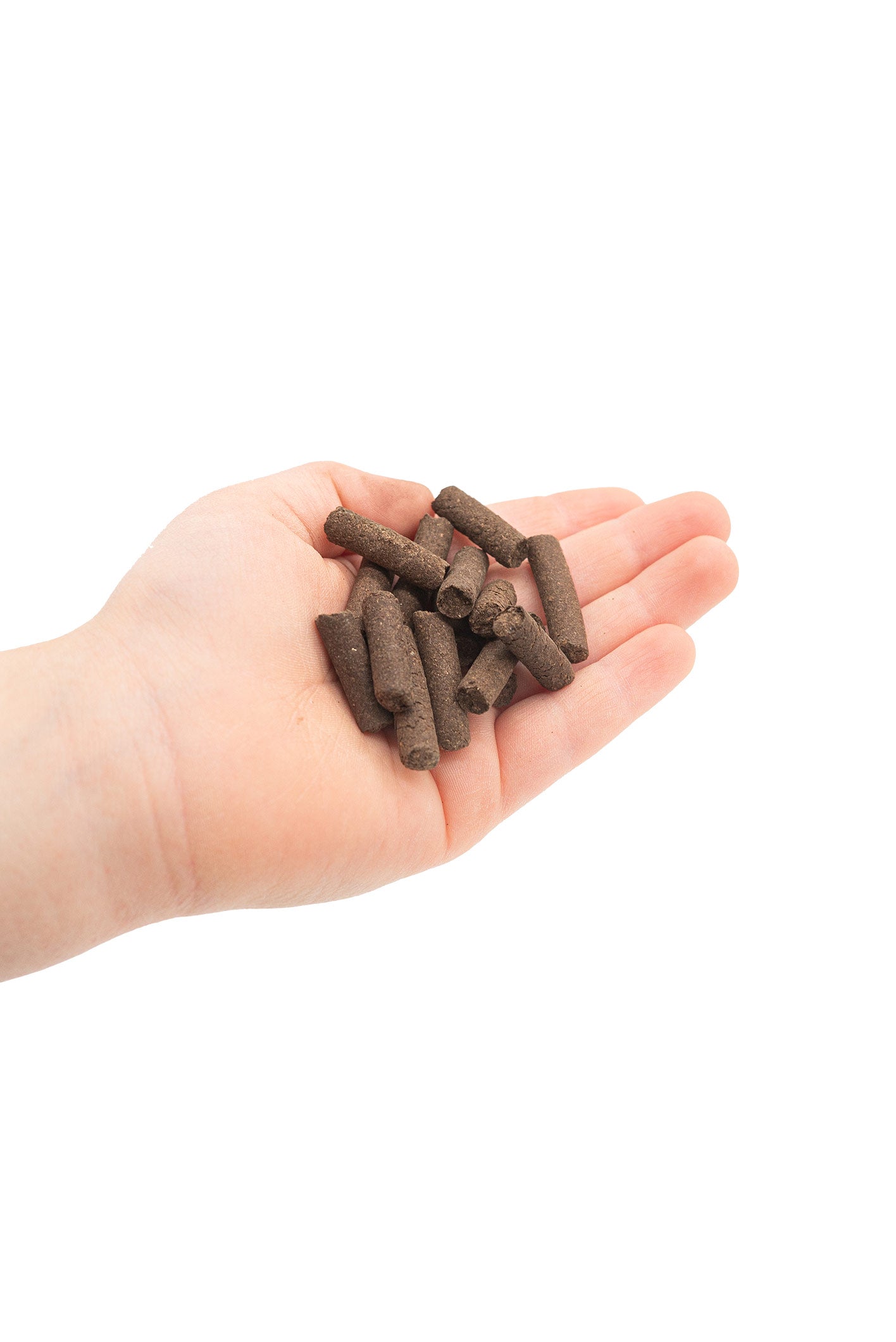 Eine Hand voll mit Bio Naturdünger Pellets